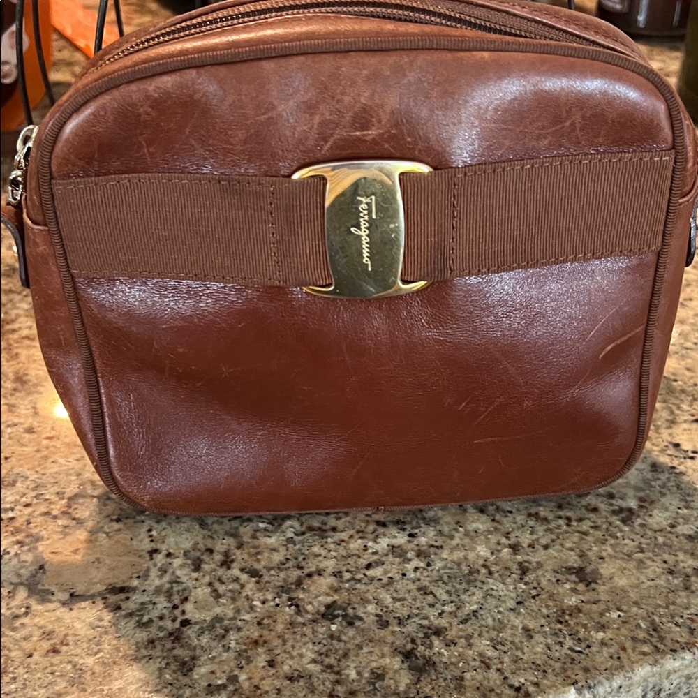 Ferragamo Brown Leather Belt Bag proof of authenticity.